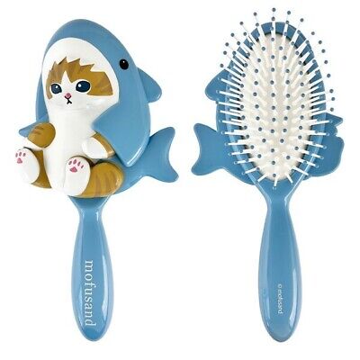 hairbrush shaped like a cartoon cat in a shark suit